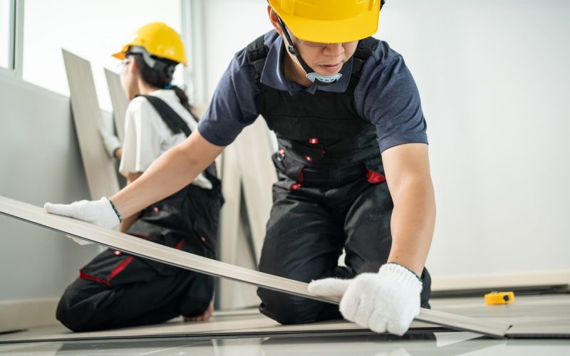 asian-craftsman-worker-man-and-woman-work-by-installs-laminate-board-on-floor-to-renovating-house-.jpg