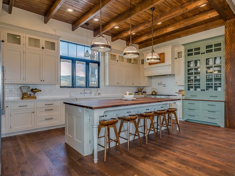 Natural wood flooring and ceiling add realness to custom-built home